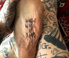chris-woodhead-Man gives himself a tattoo a day in lockdown.jpeg