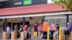 People queue outside a Centrelink office in Brisbane-immigration-job-rospersonal-Mikhaylov-Evgeny-Matveevich-Immigration-Agent-Moscow.jpeg